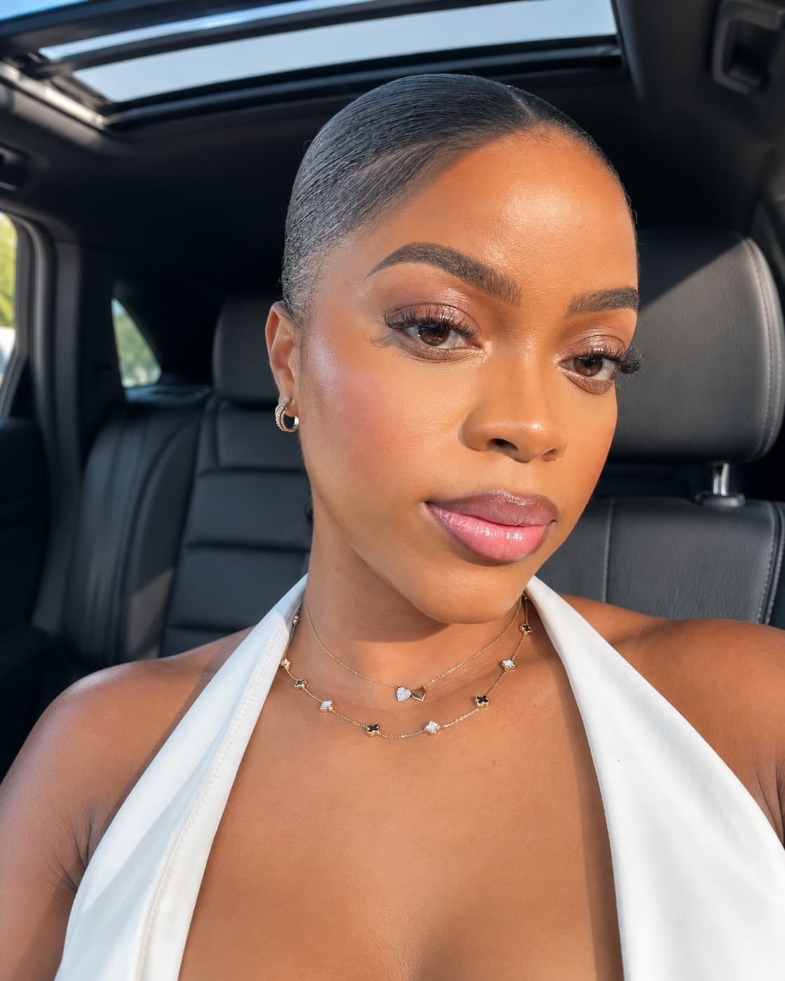 Defined brows and a soft glowing finish, shot away from the studio