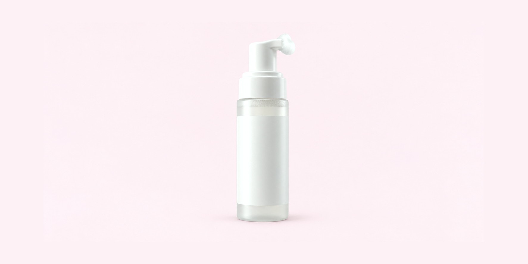 A white foaming pump bottle with foam on the nozzle, shot on pink